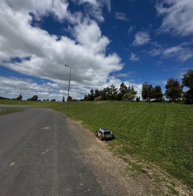 Access Pro Mowing remote-controlled mower on a steep roadside embankment