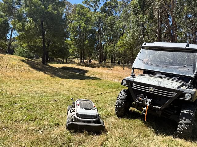 Access Pro Mowing remote-controlled mower on rural terrain